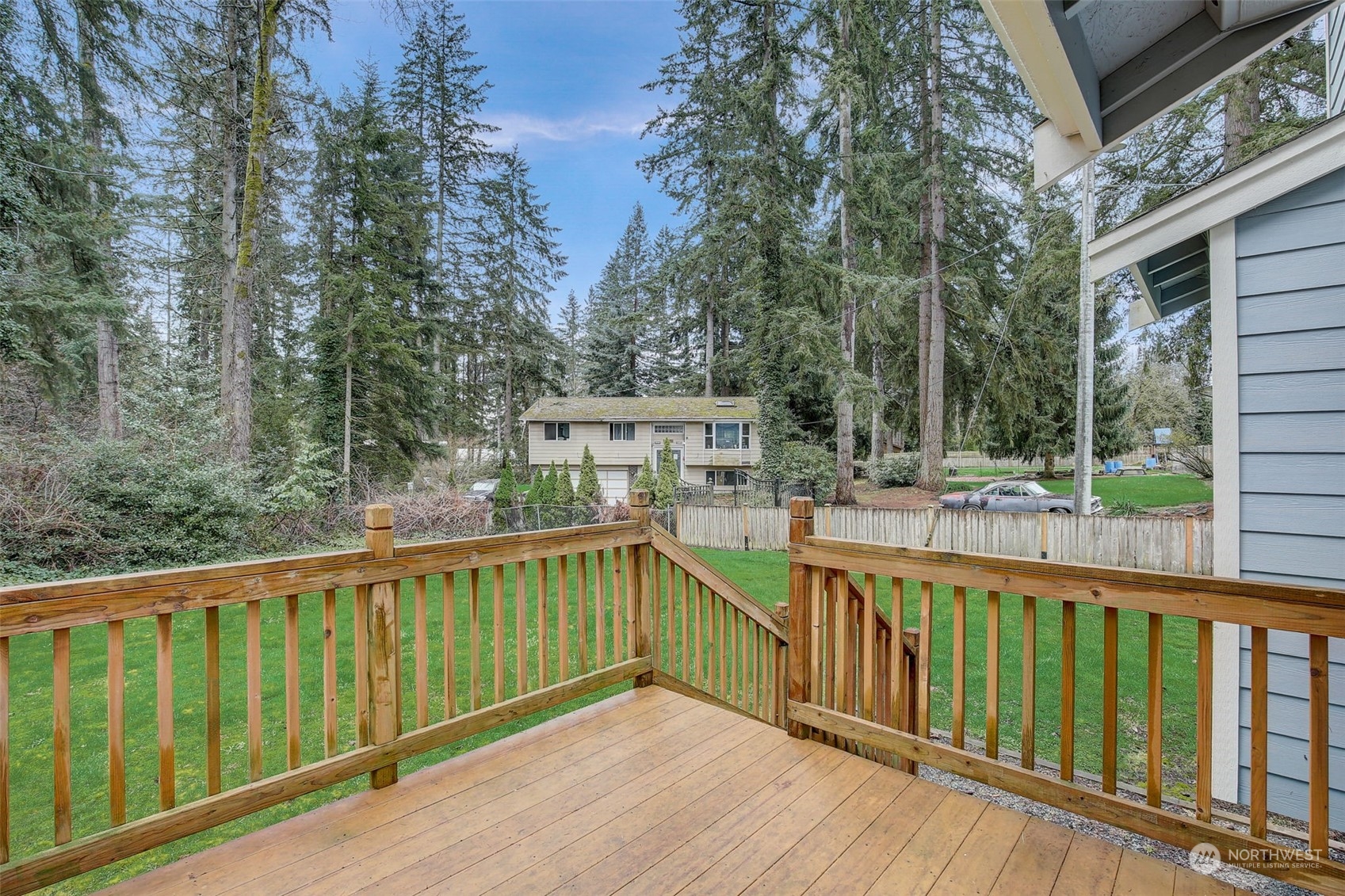 13413 Meadow Road Everett, WA 98208 - Photo 22 of 27 a view of balcony with wooden floor and outdoor seating