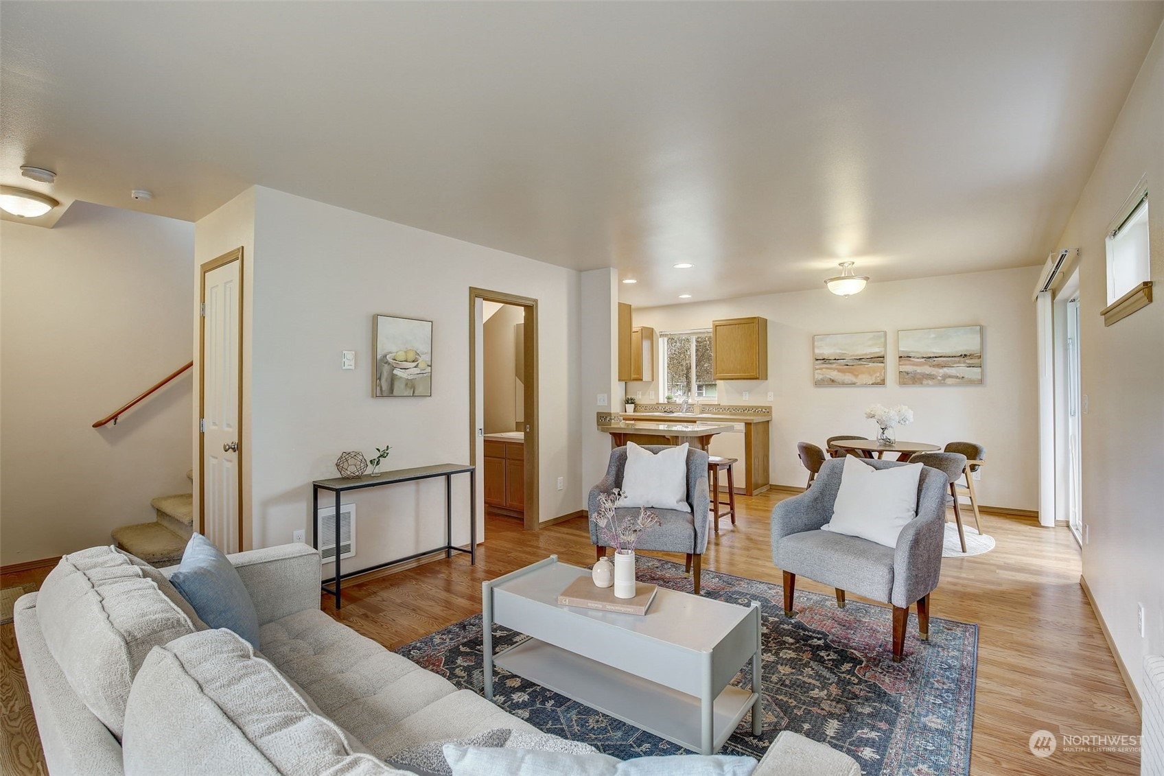 13413 Meadow Road Everett, WA 98208 - Photo 7 of 27 a living room with furniture and a wooden floor
