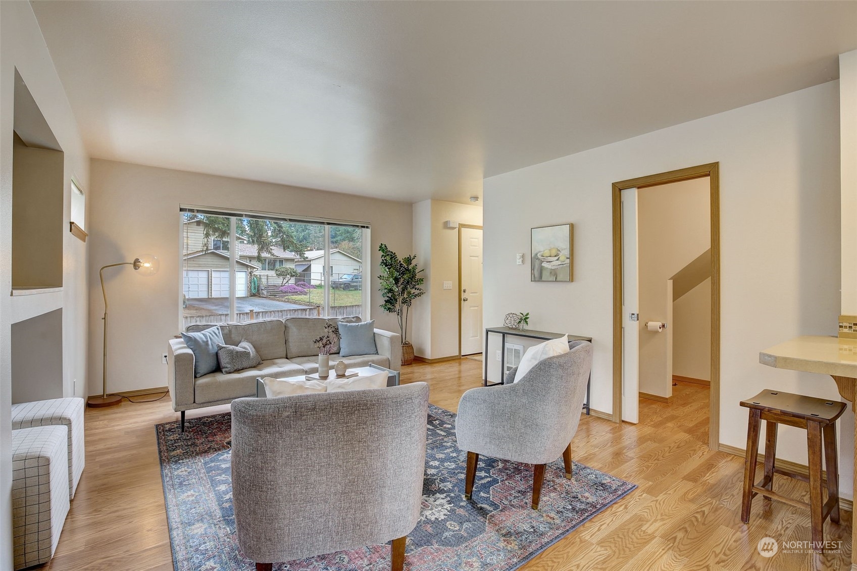 13413 Meadow Road Everett, WA 98208 - Photo 9 of 27 a living room with furniture and a wooden floor