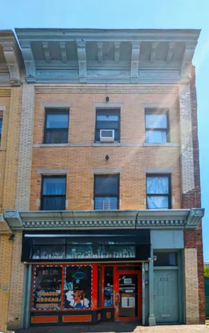 a view of building with a lot of windows and a fireplace