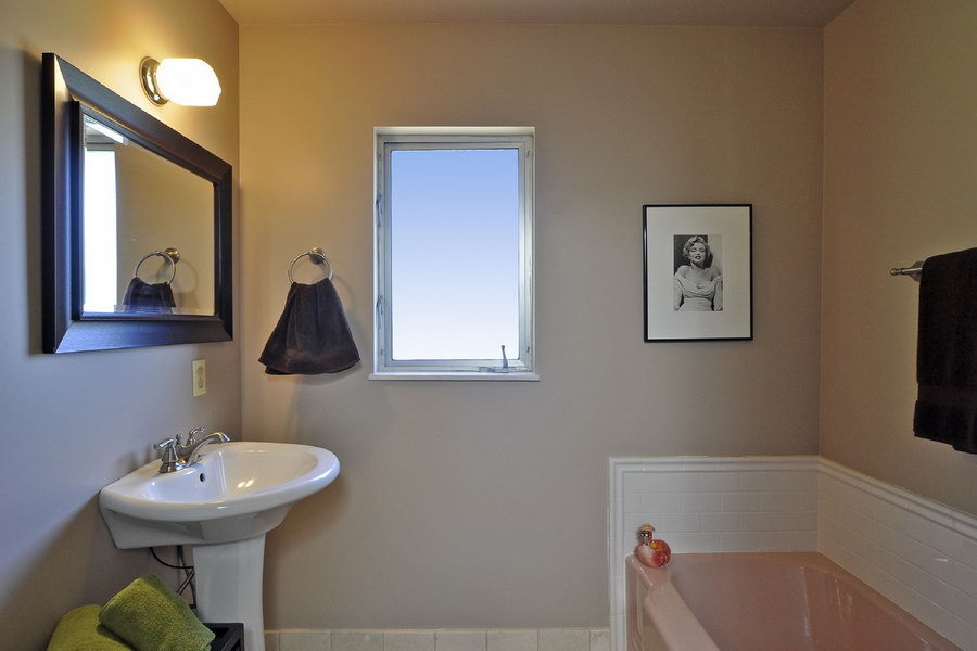 696 Cowles Road Santa Barbara, CA 93108 - Photo 11 of 14 a bathroom with a sink a toilet and a mirror
