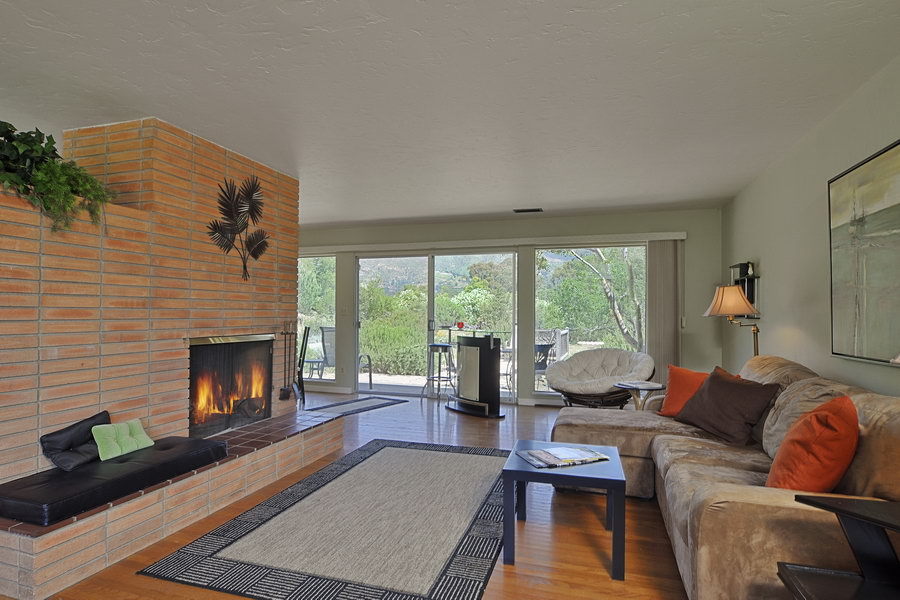 696 Cowles Road Santa Barbara, CA 93108 - Photo 2 of 14 a living room with furniture fireplace and a large window