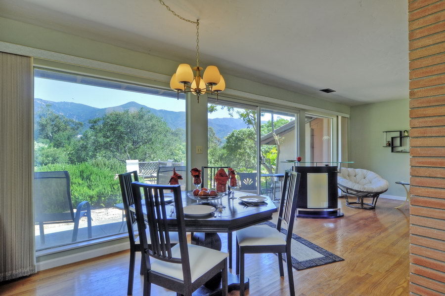 696 Cowles Road Santa Barbara, CA 93108 - Photo 4 of 14 a dining room with furniture a chandelier and wooden floor