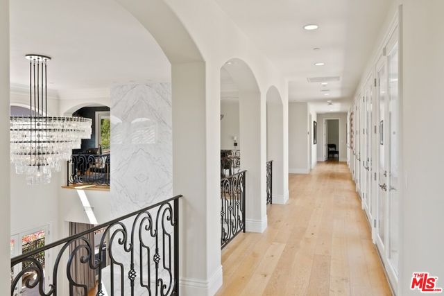 a view of entryway with a large window and wooden floor