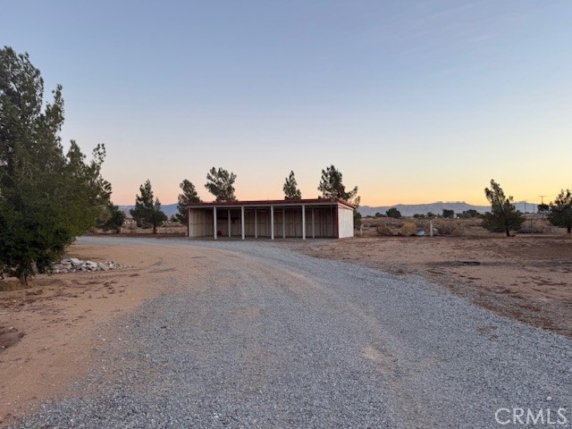 16100 Navajo Road Apple Valley, CA 92307 - Photo 11 of 55 a view of a dry area with large trees