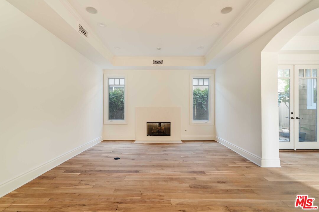 685 San Lorenzo Street Santa Monica, CA 90402 - Photo 18 of 44 a view of a room with wooden floor and windows