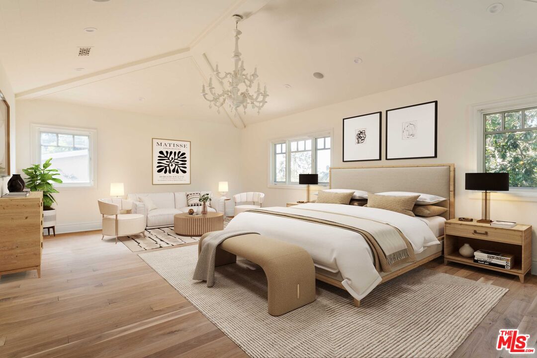 685 San Lorenzo Street Santa Monica, CA 90402 - Photo 22 of 44 a spacious bedroom with a bed and a chandelier