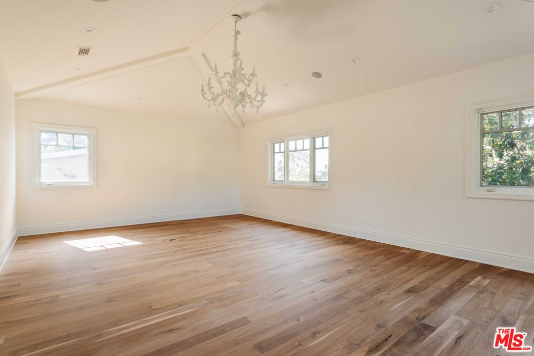 685 San Lorenzo Street Santa Monica, CA 90402 - Photo 23 of 44 a view of an empty room with wooden floor and a window