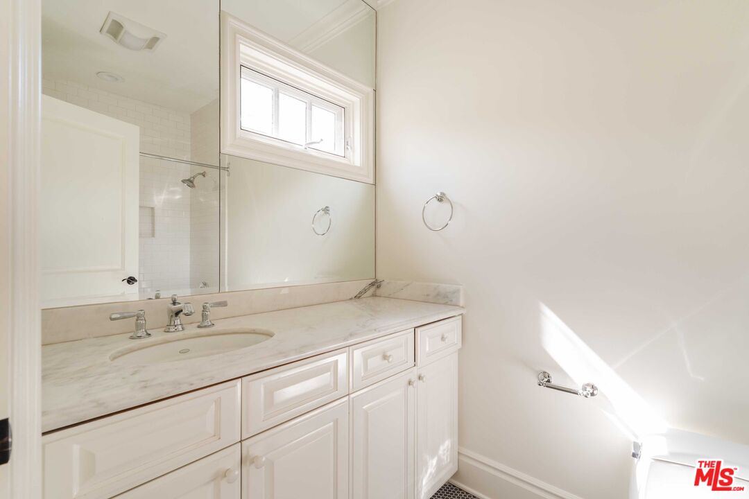 685 San Lorenzo Street Santa Monica, CA 90402 - Photo 31 of 44 a bathroom with a sink and a mirror