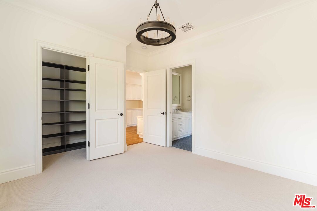 685 San Lorenzo Street Santa Monica, CA 90402 - Photo 35 of 44 a view of walk in closet with empty racks
