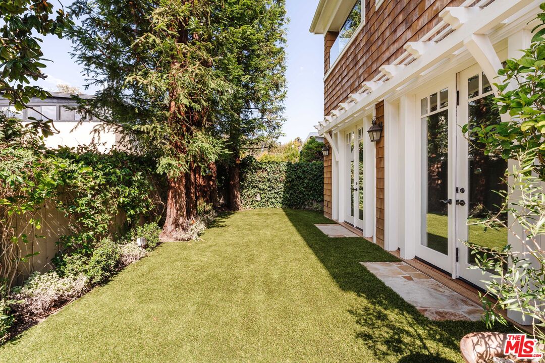 685 San Lorenzo Street Santa Monica, CA 90402 - Photo 38 of 44 a view of a yard with plants and wooden fence