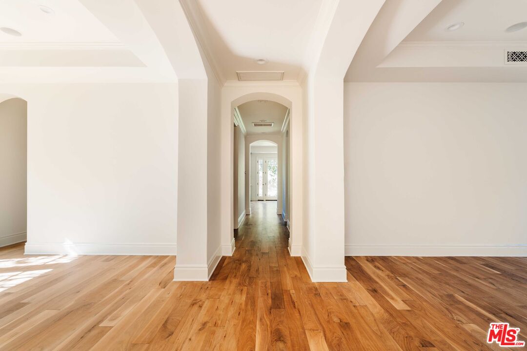 685 San Lorenzo Street Santa Monica, CA 90402 - Photo 4 of 44 a view of a bedroom with wooden floor and front door