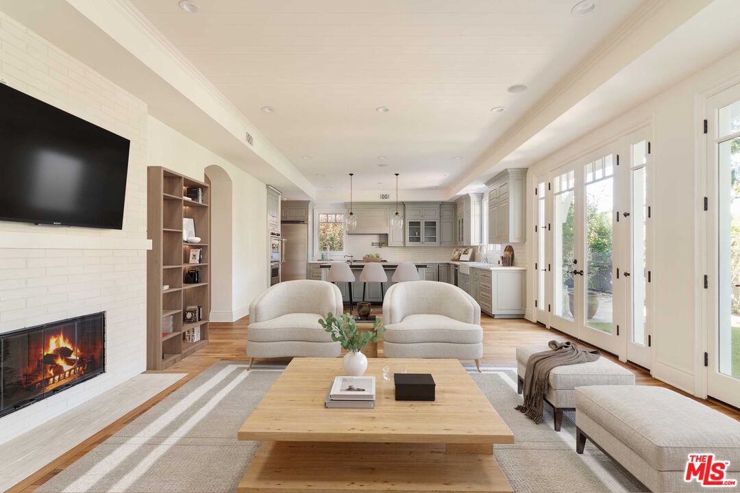 685 San Lorenzo Street Santa Monica, CA 90402 - Photo 7 of 44 a living room with furniture fireplace and flat screen tv