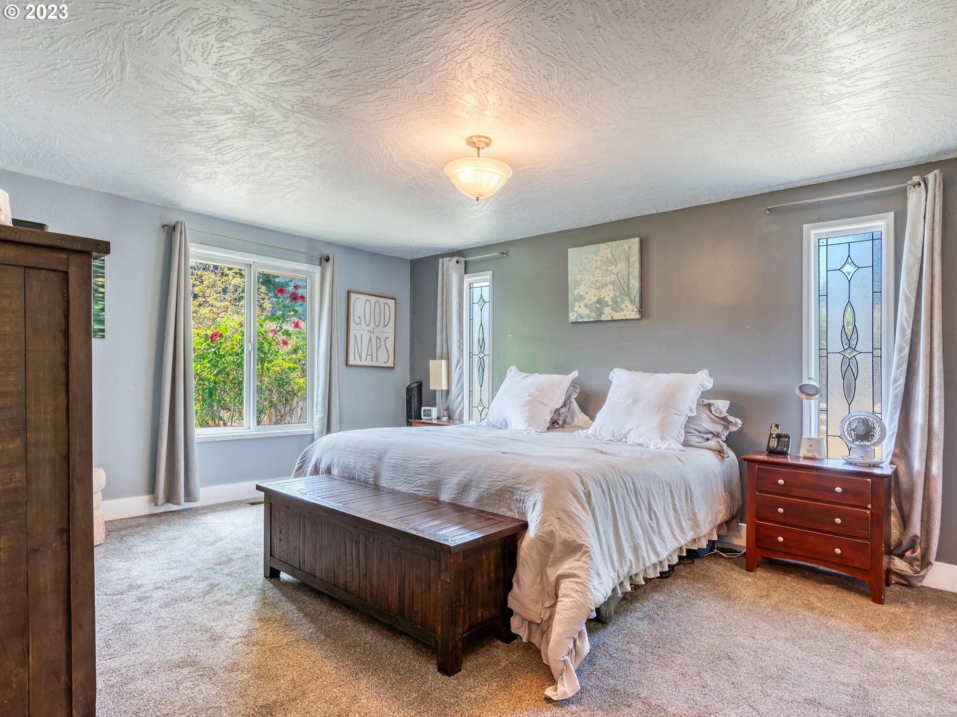 38437 McKenzie Highway Springfield, OR 97478 - Photo 12 of 48 a bedroom with a bed and a large window
