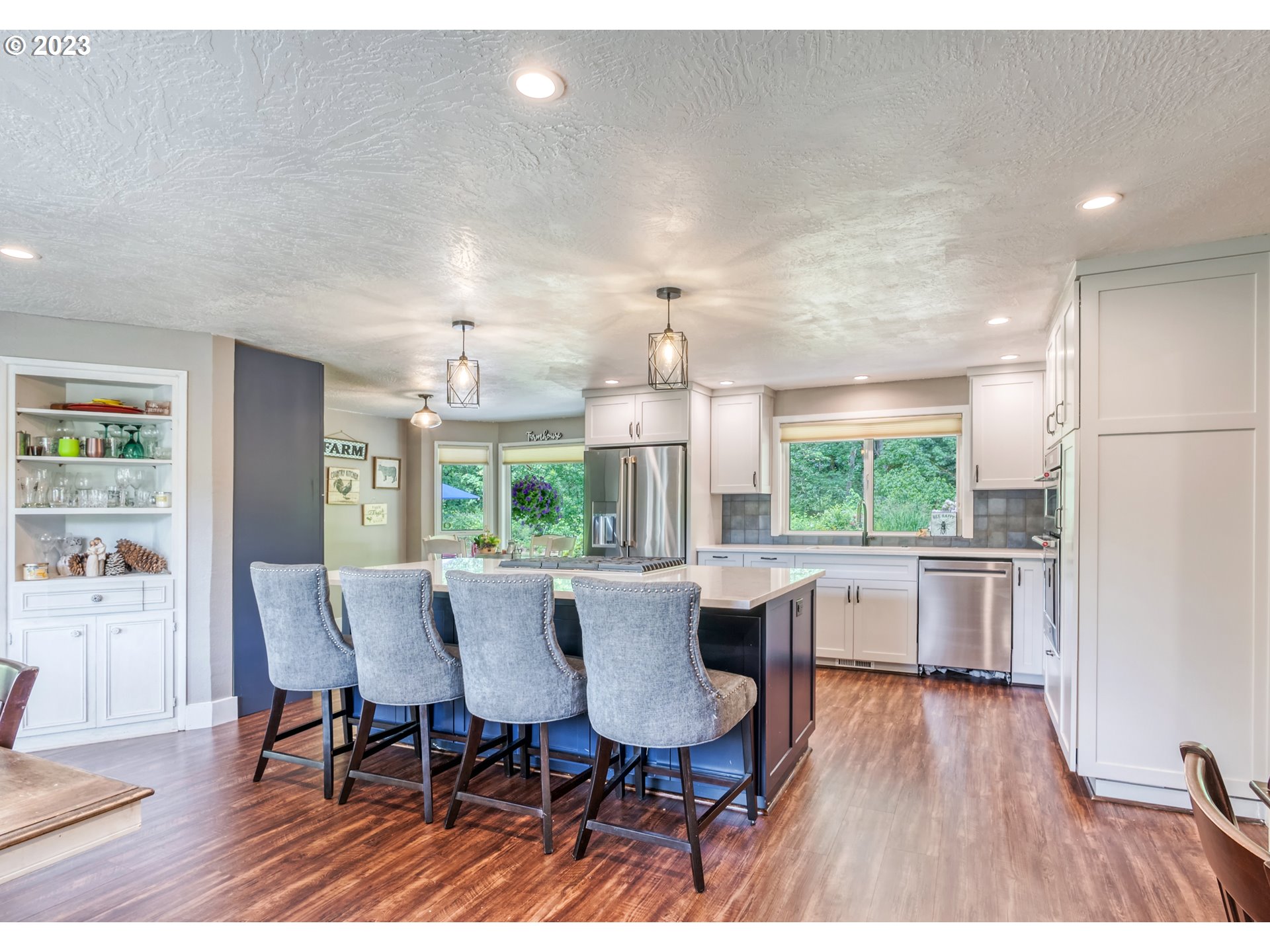 38437 McKenzie Highway Springfield, OR 97478 - Photo 3 of 48 a view of a dining room with furniture window and wooden floor