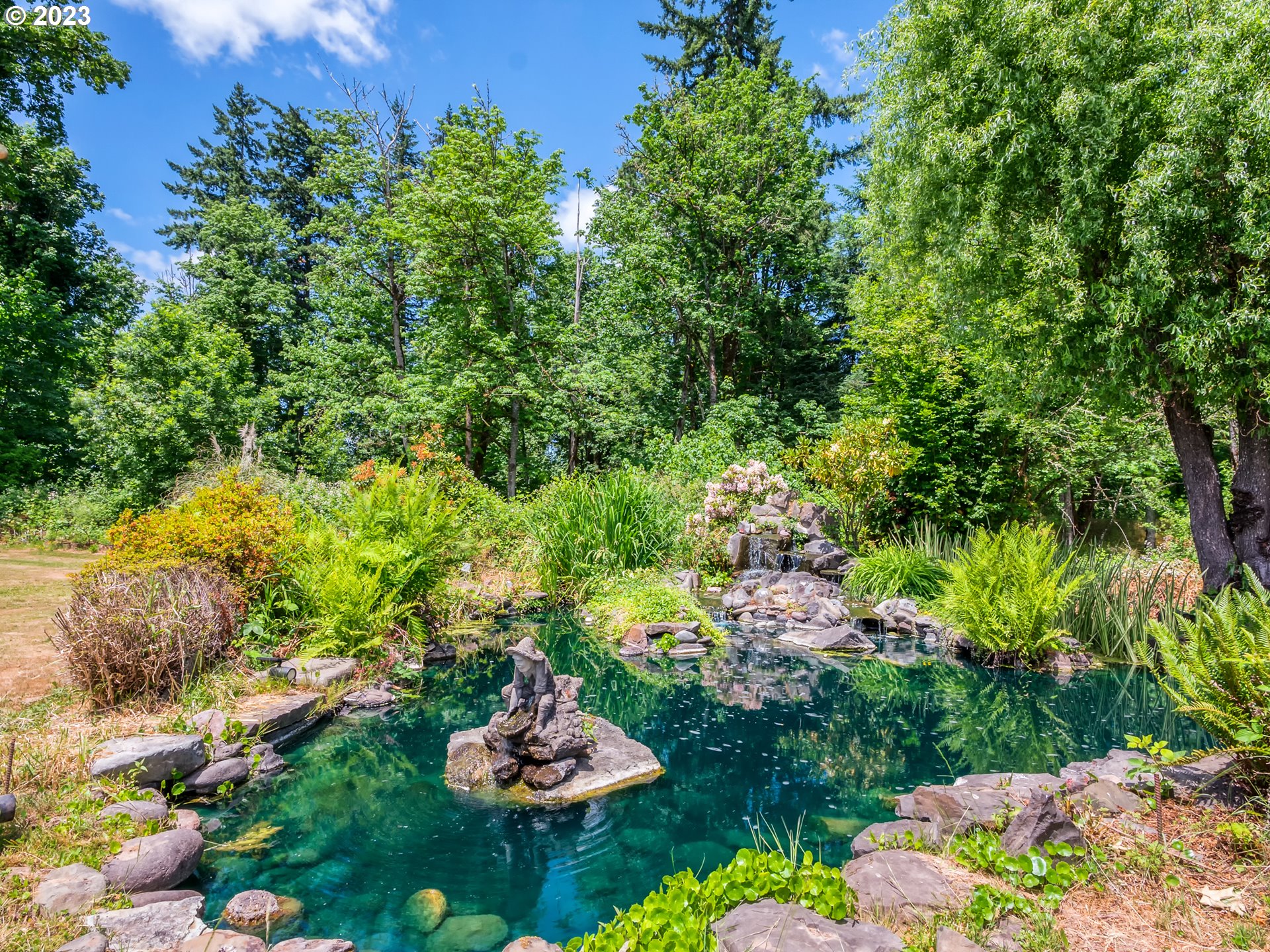 38437 McKenzie Highway Springfield, OR 97478 - Photo 32 of 48 a view of a lake with a table and a fire pit