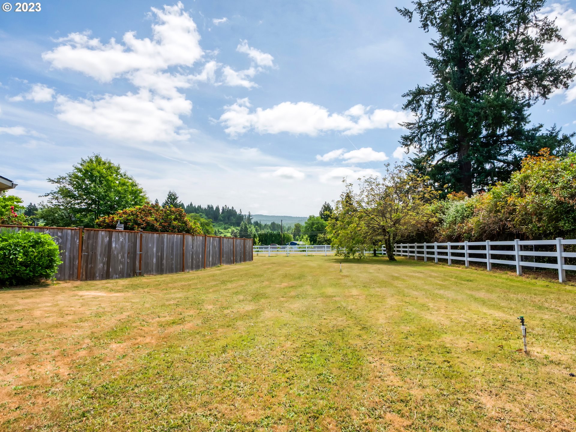 38437 McKenzie Highway Springfield, OR 97478 - Photo 37 of 48 a swimming pool with lawn chairs and wooden fence