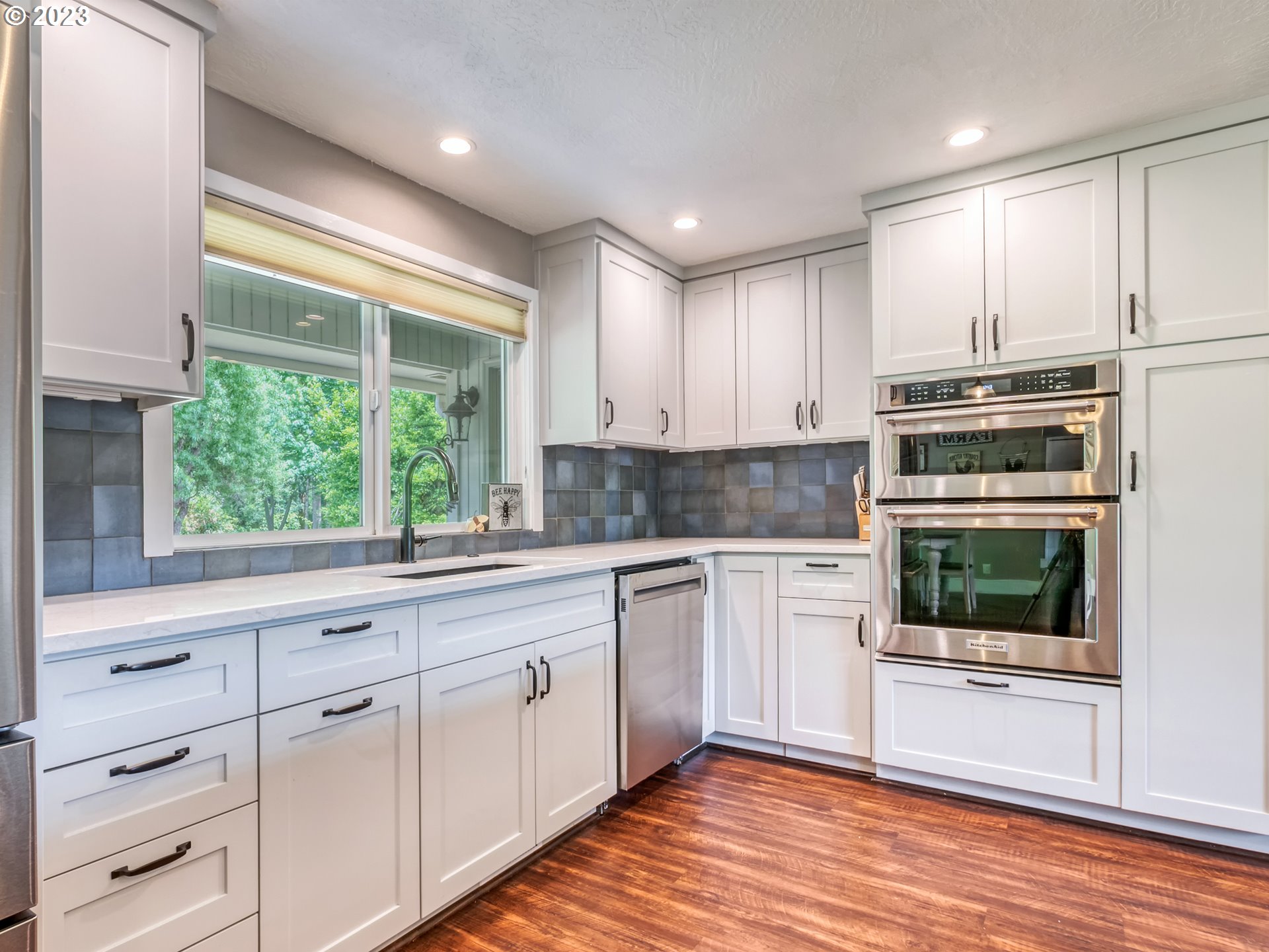 38437 McKenzie Highway Springfield, OR 97478 - Photo 4 of 48 a kitchen with white cabinets and window