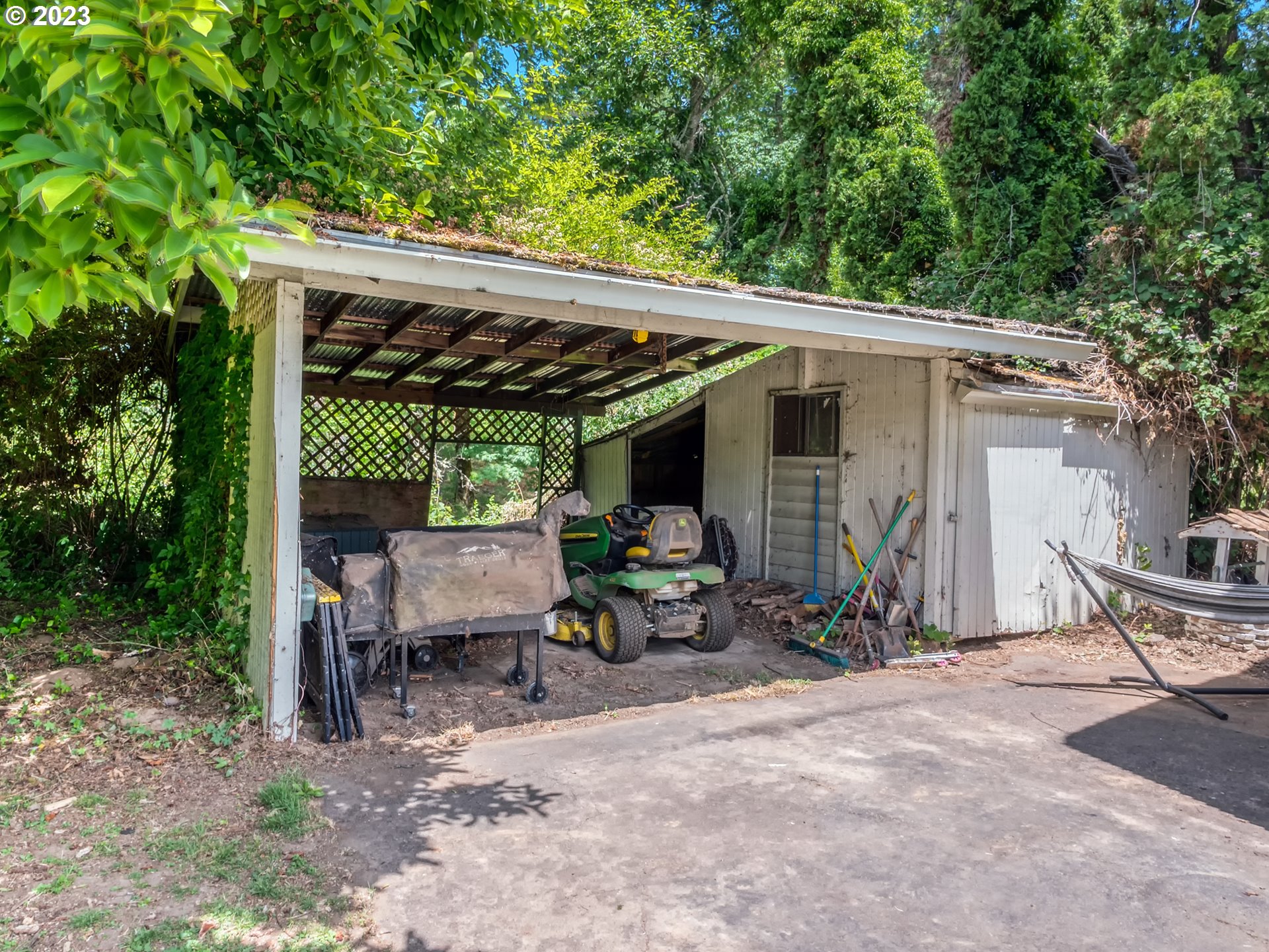 38437 McKenzie Highway Springfield, OR 97478 - Photo 41 of 48 a view of patio with a table and chairs under an umbrella