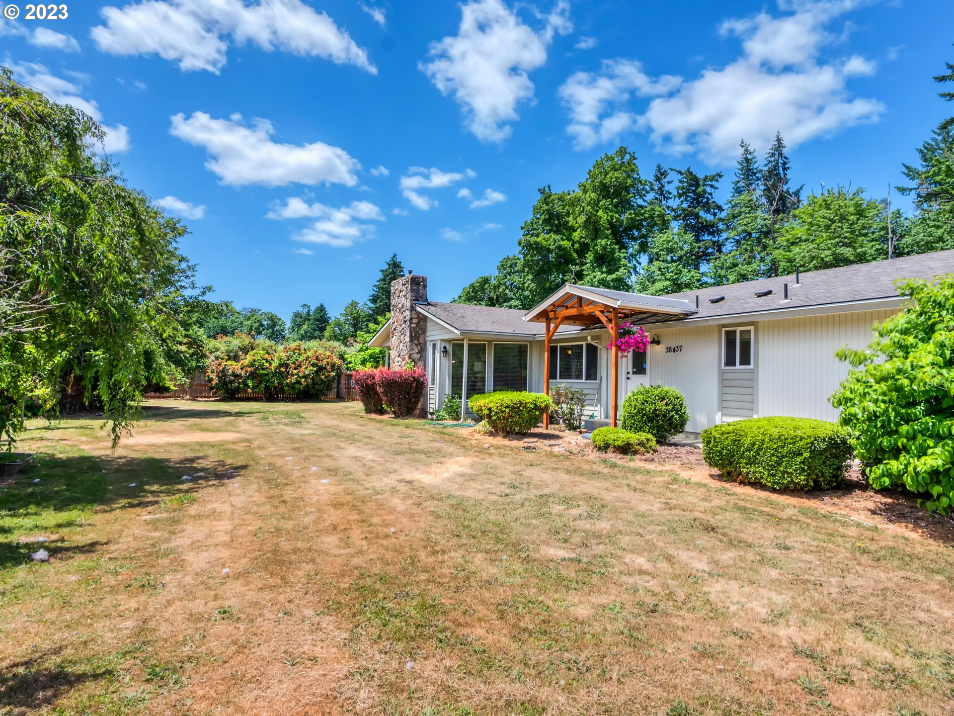 38437 McKenzie Highway Springfield, OR 97478 - Photo 43 of 48 a front view of a house with a yard