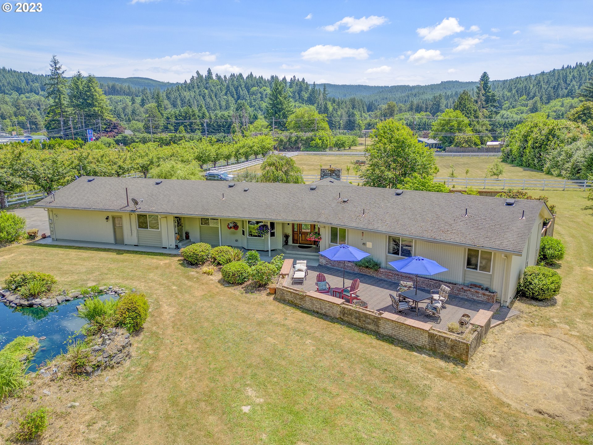 38437 McKenzie Highway Springfield, OR 97478 - Photo 46 of 48 an aerial view of a house with swimming pool and a yard