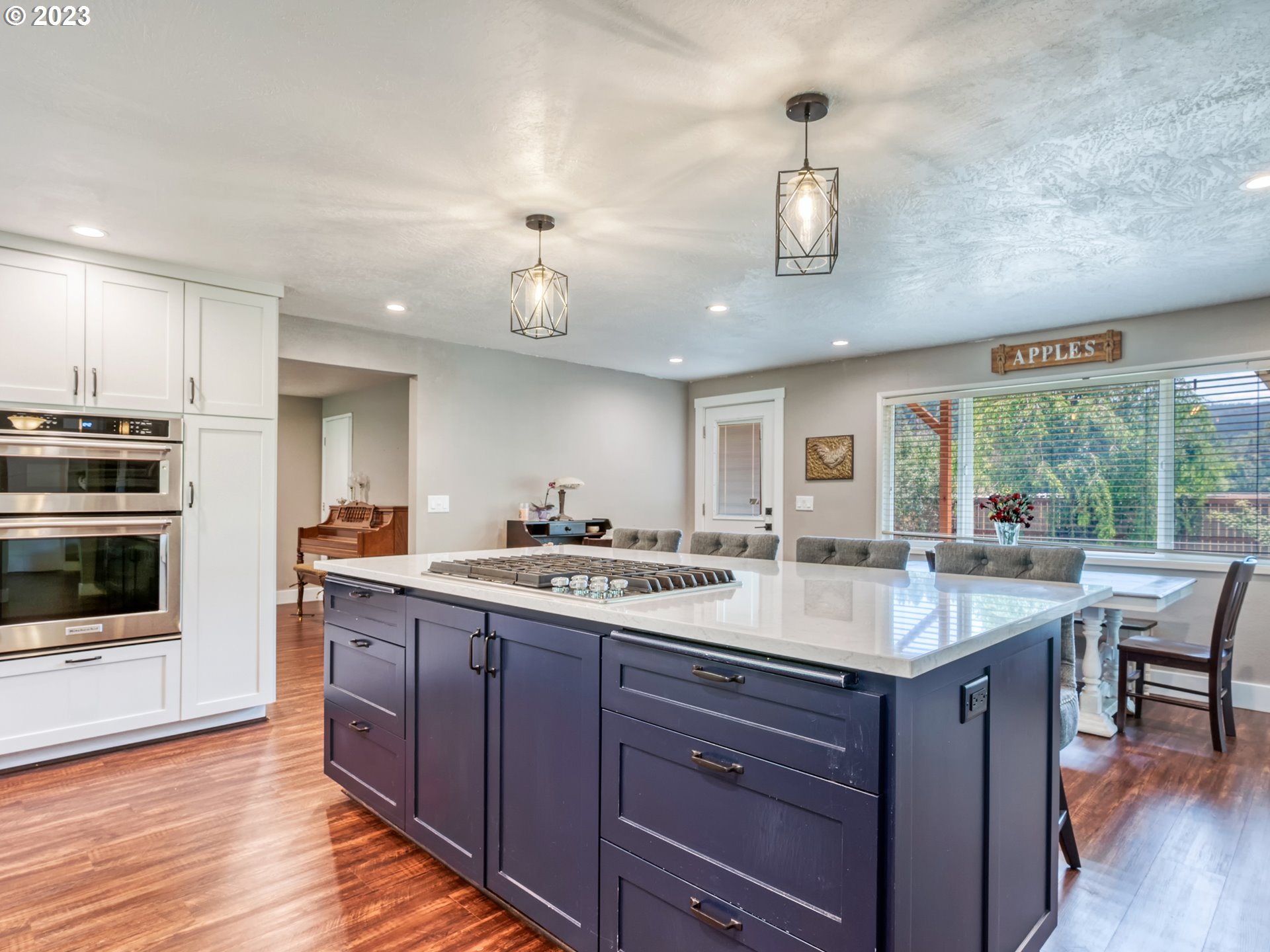 38437 McKenzie Highway Springfield, OR 97478 - Photo 7 of 48 a kitchen with center island and wooden floor