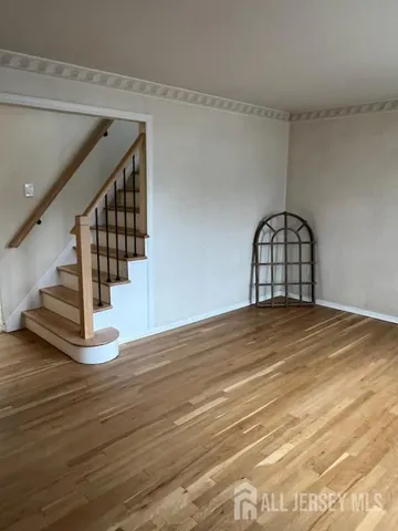 a view of wooden floor in an empty room