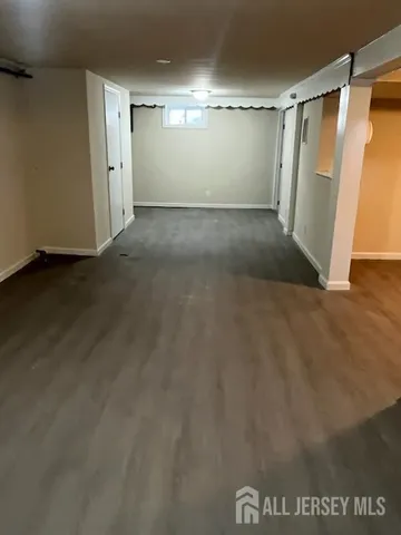 a view of a room with wooden floor and closet