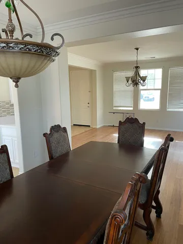 a view of a workspace with furniture and window