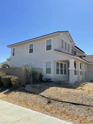 a house view with a backyard space