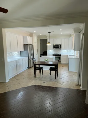 a view of kitchen with breakfast area