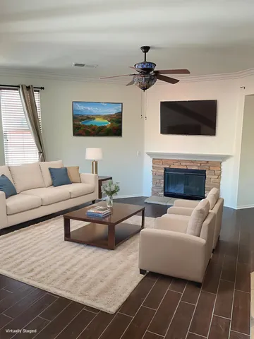 a living room with furniture and a fireplace