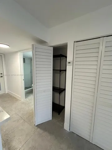 a view of living room with furniture and a chandelier