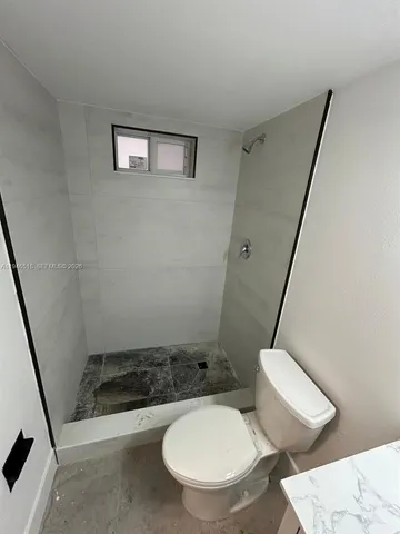 a view of an empty room with a balcony