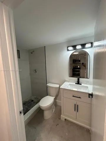 a kitchen that has a sink and a stove in it