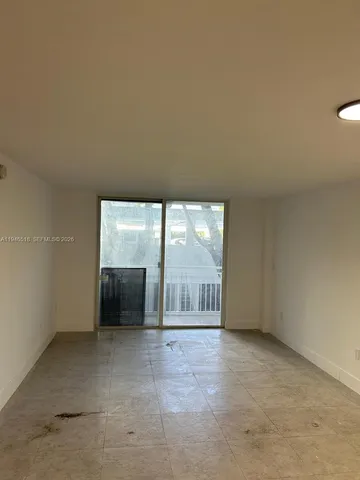 a kitchen with a sink a stove and microwave