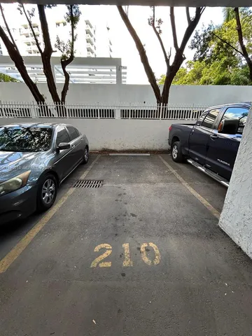 a view of a roof deck with table and chairs