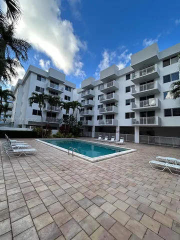a view of a building with backyard