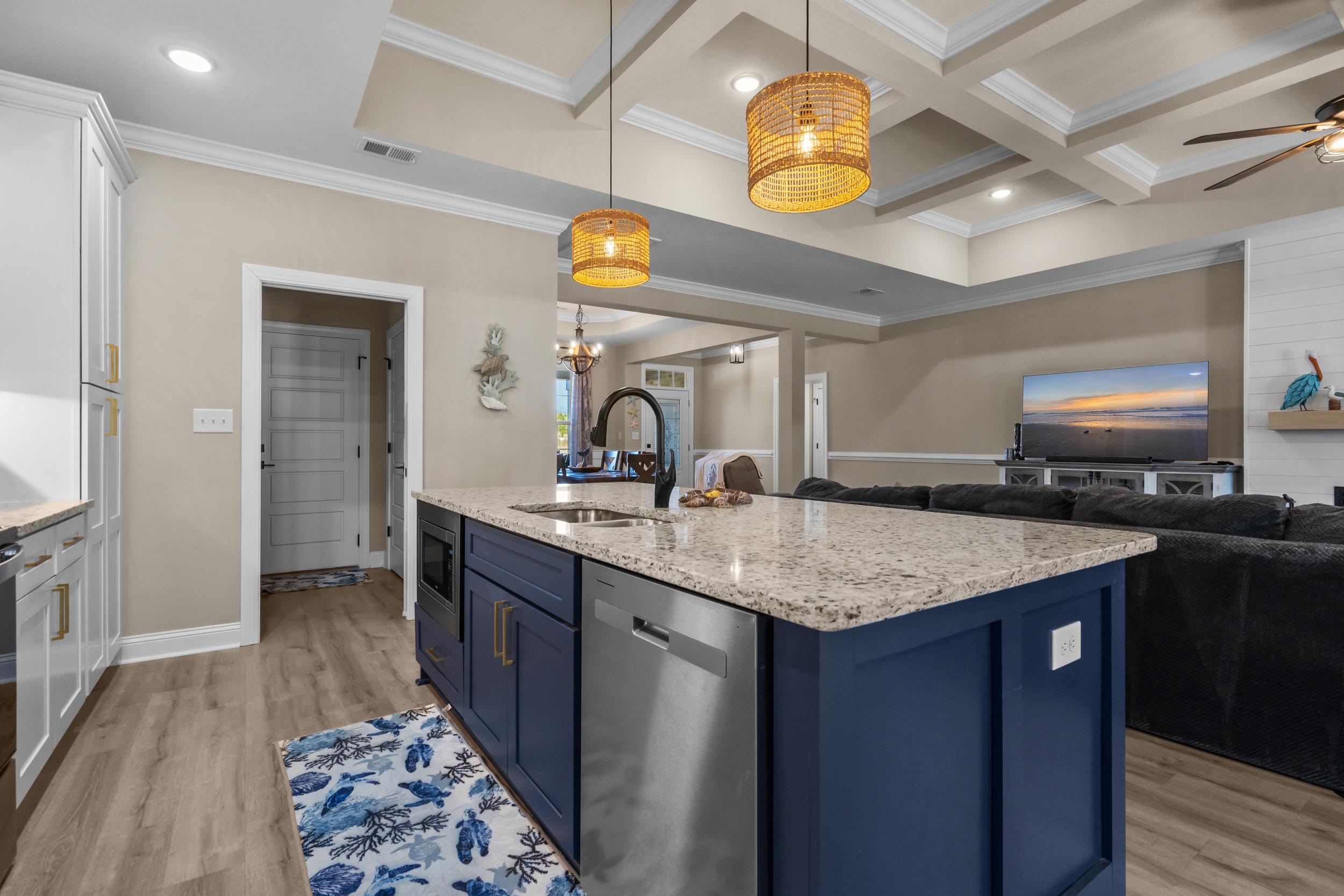 1061 Busy Corner Road Conway, SC 29527 - Photo 14 of 37 Kitchen featuring blue cabinetry, stainless steel appliances, a breakfast bar, light stone counters, and a kitchen island with sink