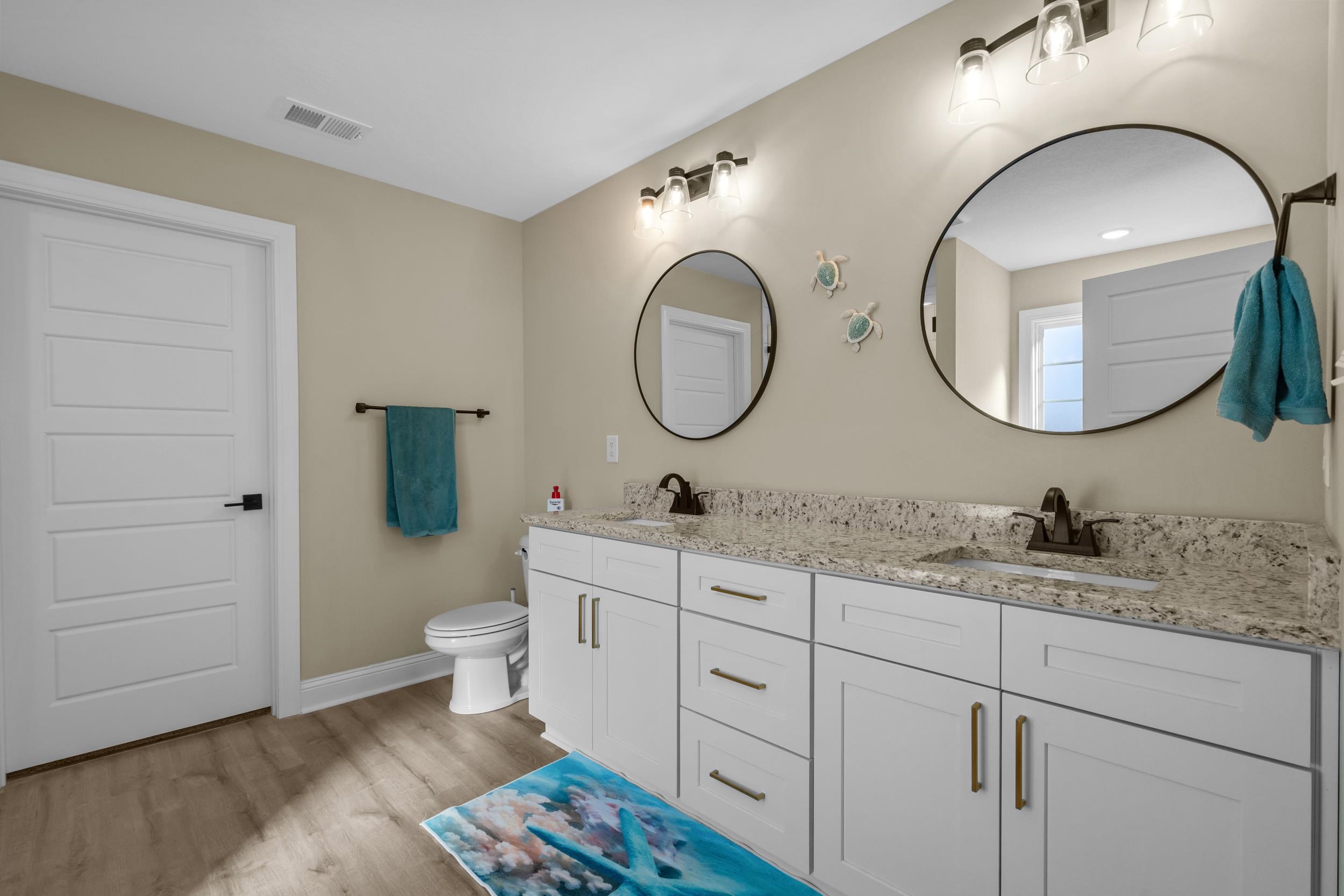 1061 Busy Corner Road Conway, SC 29527 - Photo 21 of 37 Carpeted bedroom with a tray ceiling, ornamental molding, ceiling fan, and connected bathroom
