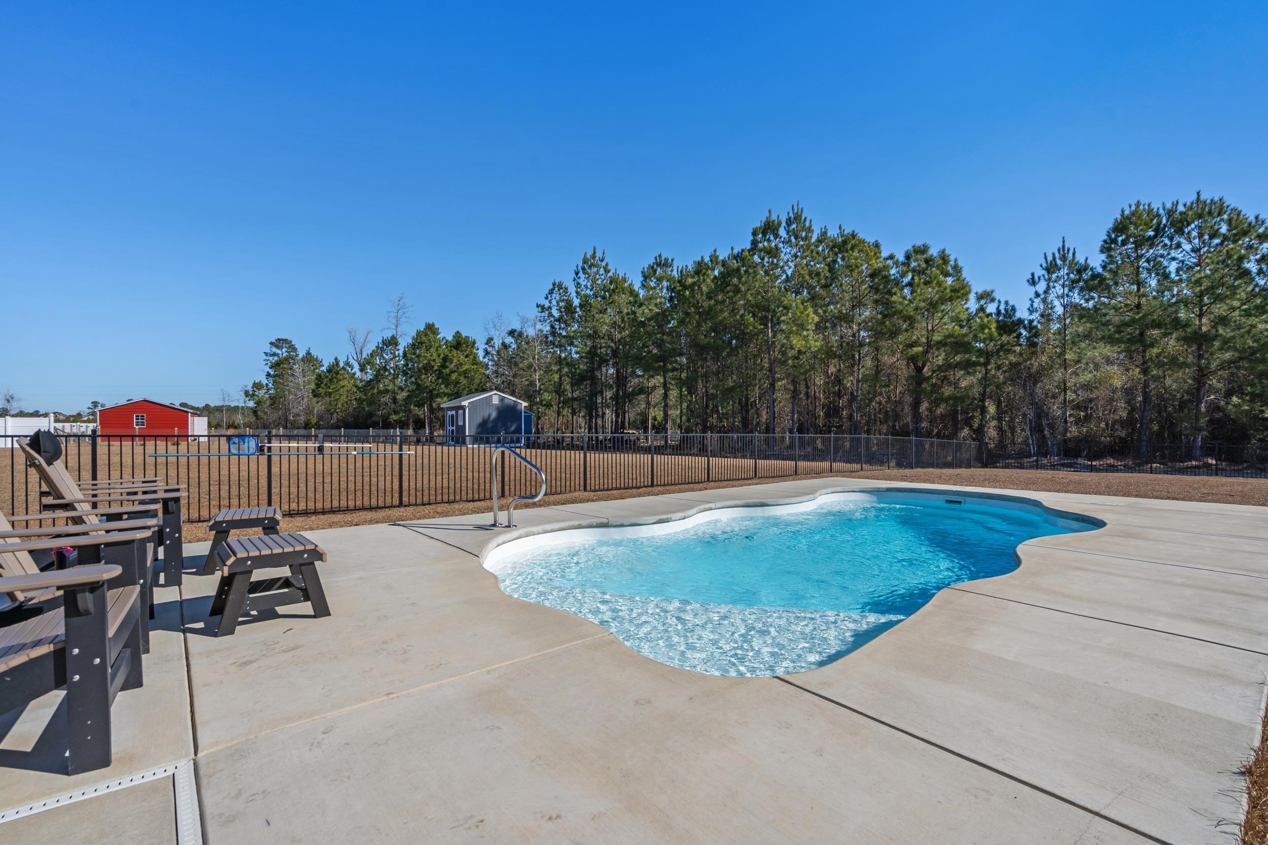 1061 Busy Corner Road Conway, SC 29527 - Photo 31 of 37 Washroom featuring washing machine and clothes dryer and wood finished floors