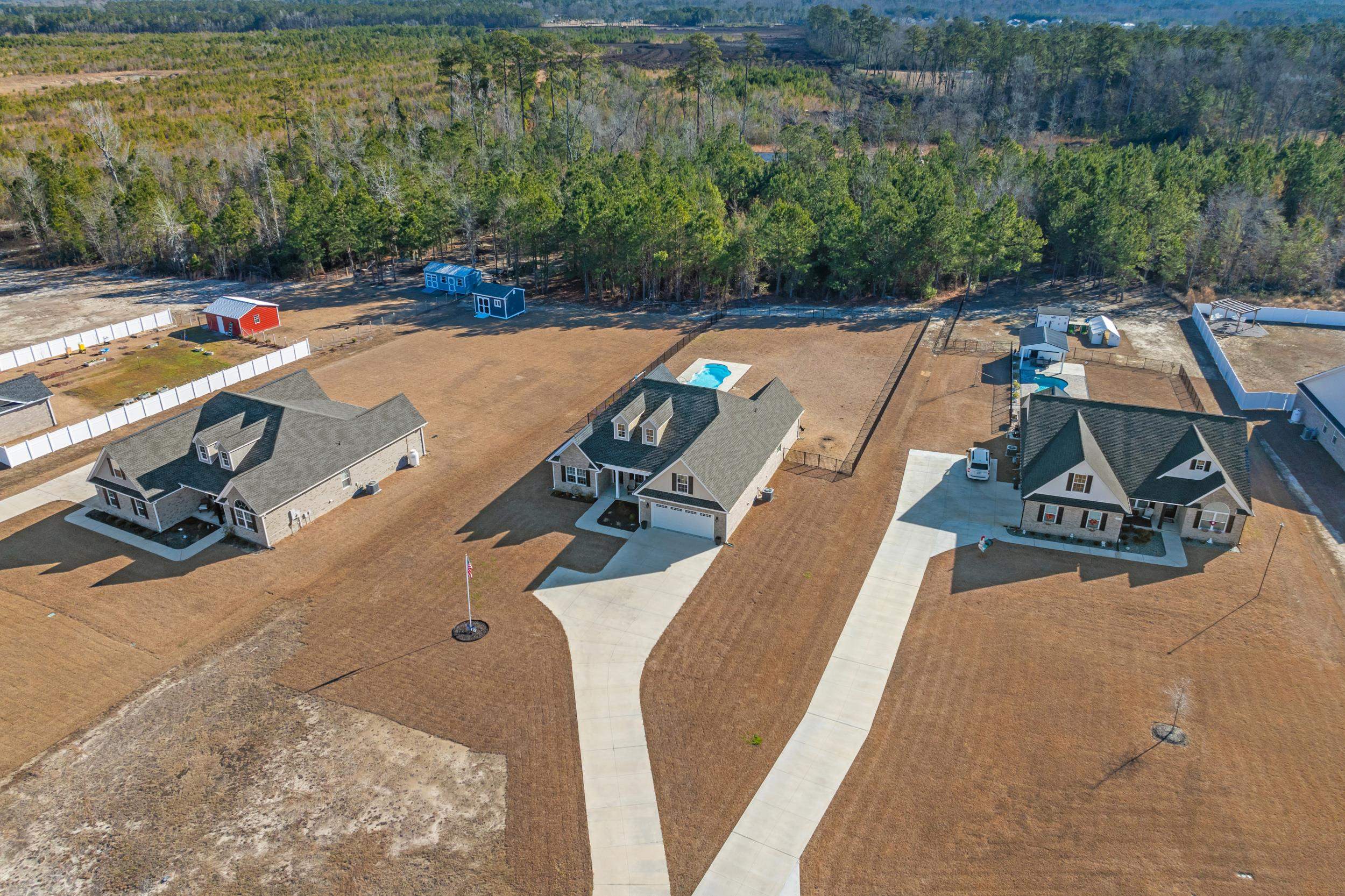 1061 Busy Corner Road Conway, SC 29527 - Photo 36 of 37 View of swimming pool featuring a sunroom and a patio area