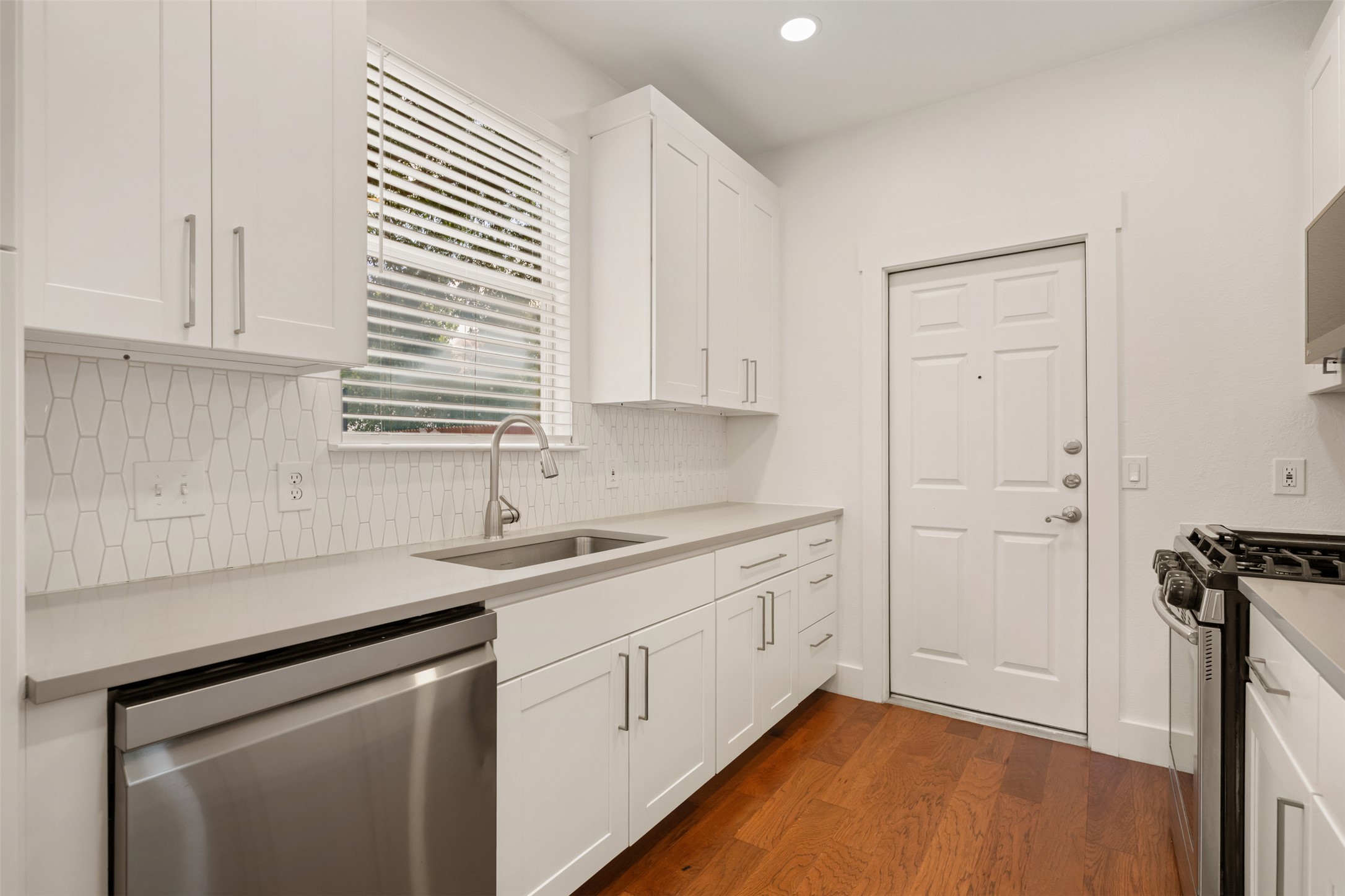 4912 Sara Drive, Unit A Austin, TX 78721 - Photo 11 of 28 Kitchen sink with window overlooking the backyard.