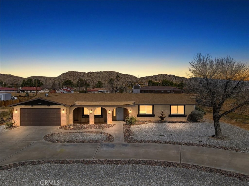 14301 Ricaree Road Apple Valley, CA 92307 - Photo 1 of 1 a view of house with a yard