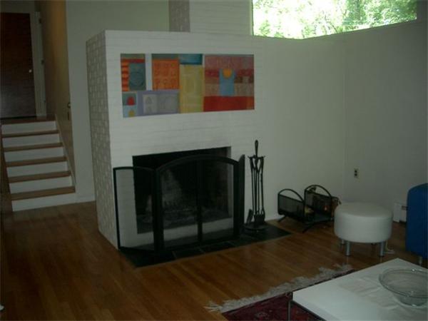 8 Mason Street Lexington, MA 02421 - Photo 5 of 14 a living room with furniture and a fireplace