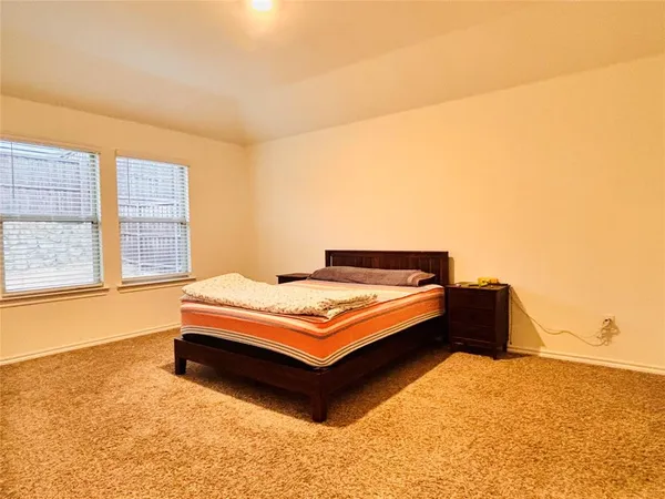 a bathroom with a double vanity sink and mirror