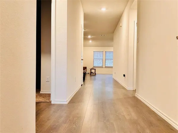 a kitchen with stainless steel appliances granite countertop a sink stove microwave and refrigerator