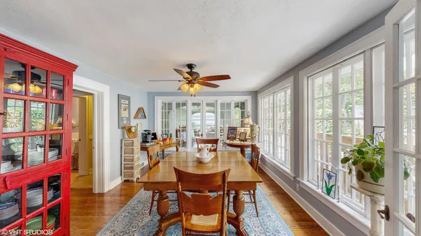 a view of entryway and hall with wooden floor