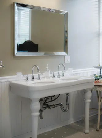 a bed room with a bed and a chandelier