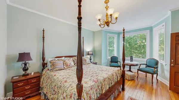 a bedroom with bed and window